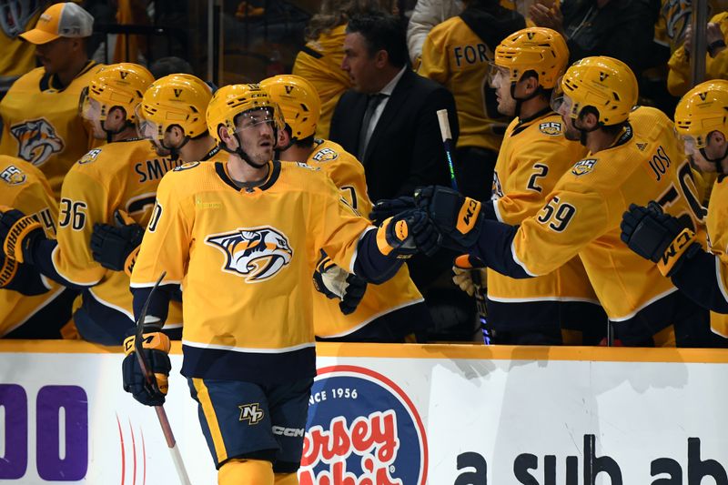 Dec 2, 2023; Nashville, Tennessee, USA; Nashville Predators center Colton Sissons (10) celebrates after a short handed goal against the New York Rangers during the second period at Bridgestone Arena. Mandatory Credit: Christopher Hanewinckel-USA TODAY Sports