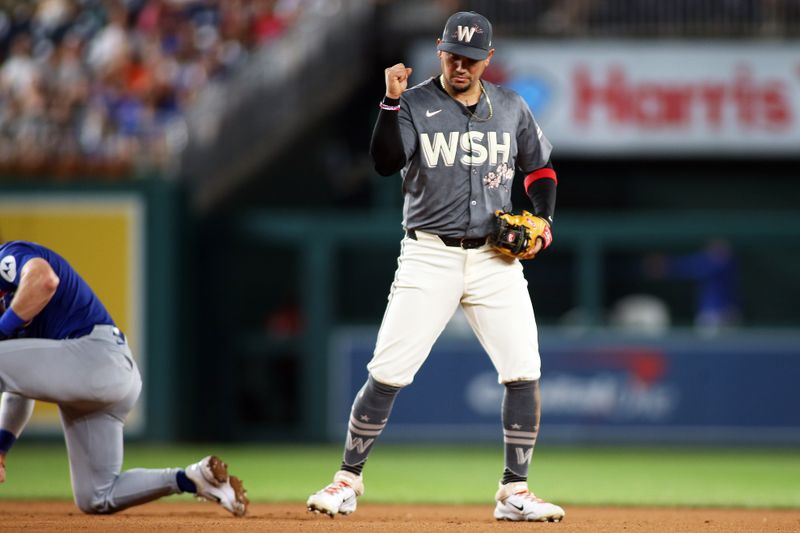 Aug 30, 2024; Washington, District of Columbia, USA; Washington Nationals second baseman Ildemaro Vargas (14) celebrates after making an out at second base during the eighth inning against the Chicago Cubs at Nationals Park. Mandatory Credit: Daniel Kucin Jr.-USA TODAY Sports


