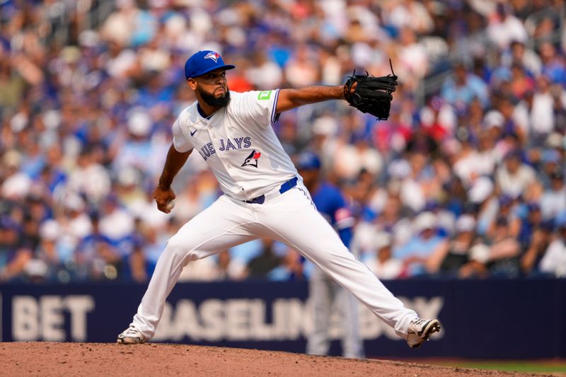 Aug 3, 2025; Toronto, Ontario, CAN; Toronto Blue Jays pitcher Seranthony Domínguez (48) pitches to the Kansas City Royals during the tenth inning at Rogers Centre. Mandatory Credit: Kevin Sousa-Imagn Images
