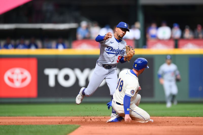 Sep 28, 2025; Seattle, Washington, USA; Seattle Mariners catcher Mitch Garver (18) slides into Los Angeles Dodgers shortstop Mookie Betts (50) to break up a double play during the fourth inning at T-Mobile Park. Mandatory Credit: Steven Bisig-Imagn Images