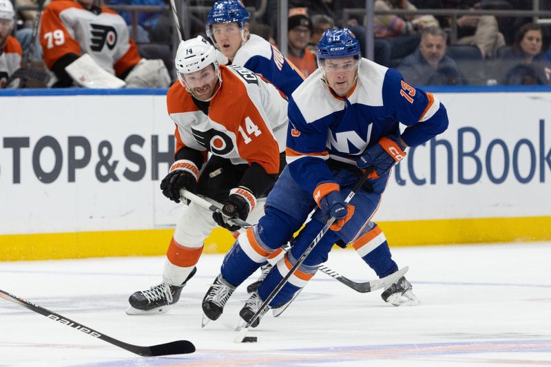 Nov 25, 2023; Elmont, New York, USA; New York Islanders center Mathew Barzal (13) skates with the puck against the Philadelphia Flyers during the second period at UBS Arena. Mandatory Credit: Thomas Salus-USA TODAY Sports