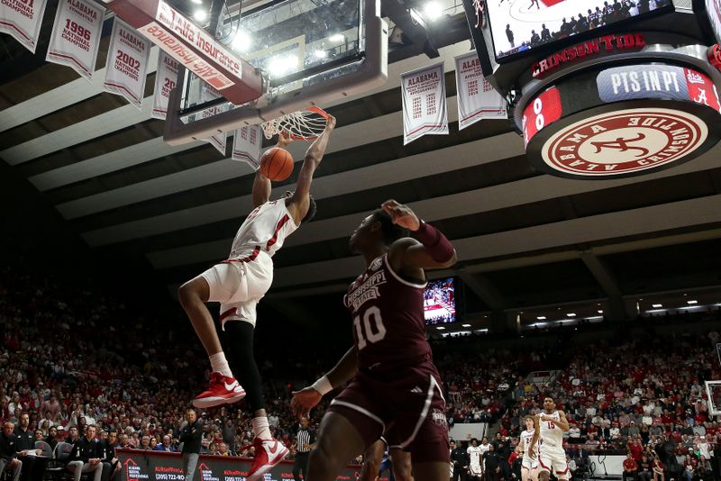 Feb 3, 2024; Tuscaloosa, Alabama, USA;  Alabama forward Mohamed Wague (11) dunks the ball against Mississippi State at Coleman Coliseum. Mandatory Credit: Gary Cosby Jr.-USA TODAY Sports