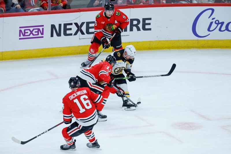 Dec 4, 2024; Chicago, Illinois, USA; Chicago Blackhawks left wing Nick Foligno (17) defends against Boston Bruins left wing Brad Marchand (63) during the third period at United Center. Mandatory Credit: Kamil Krzaczynski-Imagn Images
