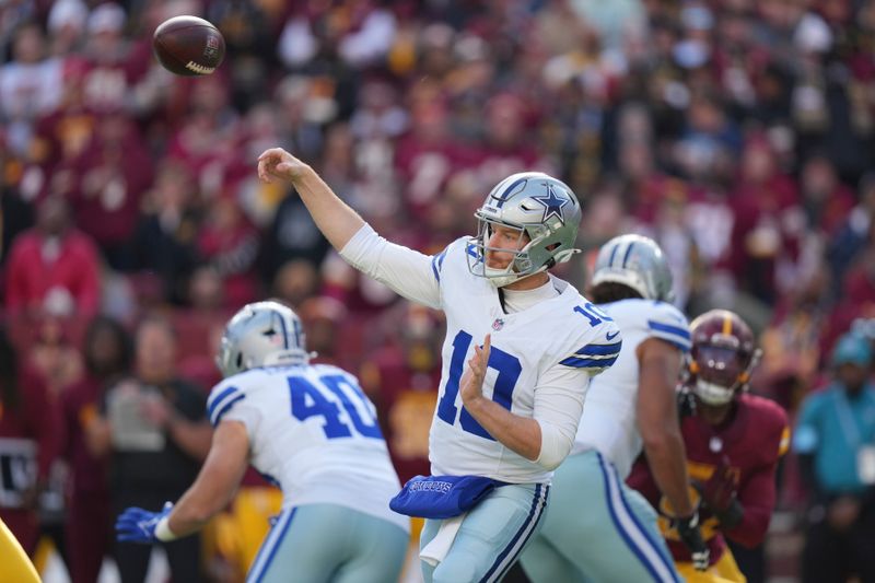 Dallas Cowboys quarterback Cooper Rush (10) passes during the first half of an NFL football game against the Washington Commanders, Sunday, Nov. 24, 2024, in Landover, Md. (AP Photo/Stephanie Scarbrough)