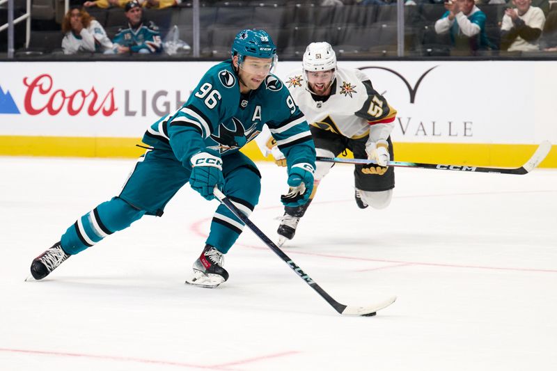 Sep 21, 2025; San Jose, California, USA; San Jose Sharks center Philipp Kurashev (96) controls the puck against Vegas Golden Knights defenseman Lukas Cormier (51) during the second period at SAP Center at San Jose. Mandatory Credit: Robert Edwards-Imagn Images
