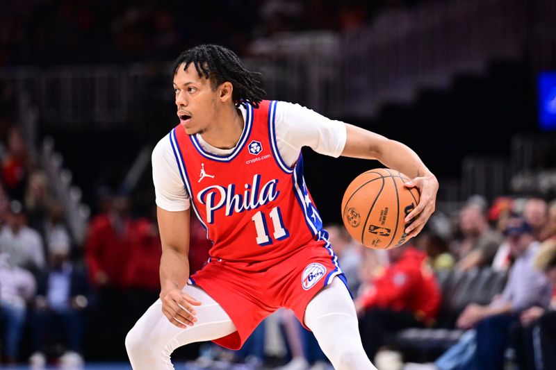 ATLANTA, GA - MARCH 23: Jeff Dowtin Jr. #11 of the Philadelphia 76ers handles the ball during the game against the Atlanta Hawks on March 23, 2025 at State Farm Arena in Atlanta, Georgia.  NOTE TO USER: User expressly acknowledges and agrees that, by downloading and/or using this Photograph, user is consenting to the terms and conditions of the Getty Images License Agreement. Mandatory Copyright Notice: Copyright 2025 NBAE (Photo by Adam Hagy/NBAE via Getty Images)