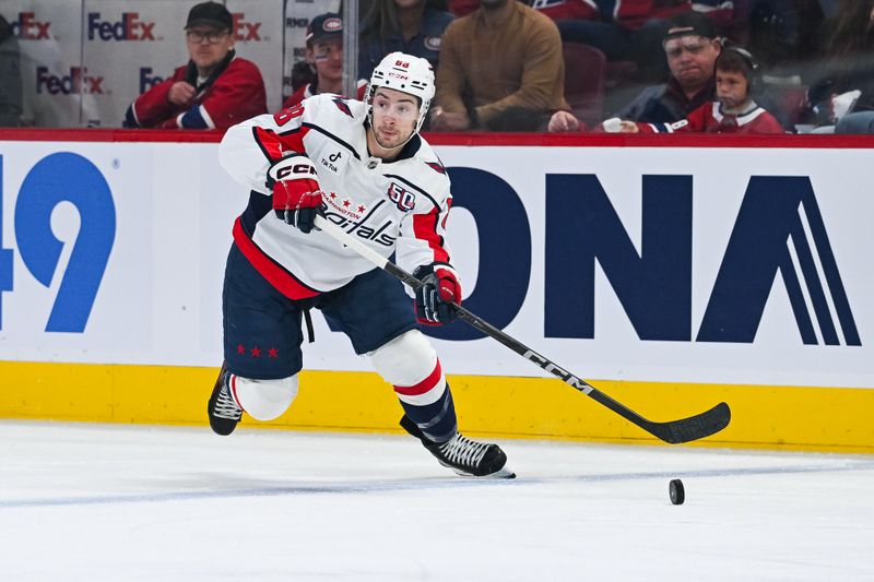 Apr 27, 2025; Montreal, Quebec, CAN; Washington Capitals left wing Andrew Mangiapane (88) plays the puck against the Montreal Canadiens during the first period in game four of the first round of the 2025 Stanley Cup Playoffs at Bell Centre. Mandatory Credit: David Kirouac-Imagn Images