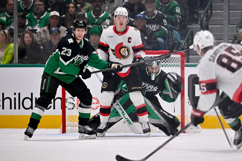 Nov 30, 2025; Dallas, Texas, USA; Dallas Stars goaltender Casey DeSmith (1) faces a shot by Ottawa Senators defenseman Jake Sanderson (85) as defenseman Esa Lindell (23) and left wing Brady Tkachuk (7) look on during the second period at the American Airlines Center. Mandatory Credit: Jerome Miron-Imagn Images
