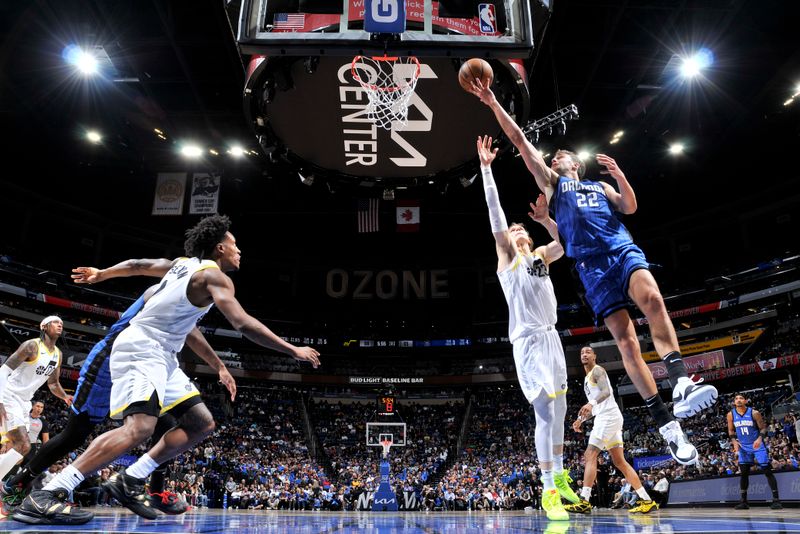 ORLANDO, FL - FEBRUARY 29: Franz Wagner #22 of the Orlando Magic drives to the basket during the game against the Utah Jazz on February 29, 2024 at Amway Center in Orlando, Florida. NOTE TO USER: User expressly acknowledges and agrees that, by downloading and or using this photograph, User is consenting to the terms and conditions of the Getty Images License Agreement. Mandatory Copyright Notice: Copyright 2024 NBAE (Photo by Fernando Medina/NBAE via Getty Images)