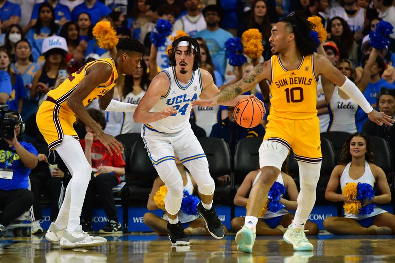 Mar 2, 2023; Los Angeles, California, USA; UCLA Bruins guard Jaime Jaquez Jr. (24) controls the ball against Arizona State Sun Devils forward Alonzo Gaffney (32) and guard Frankie Collins (10) during the first half at Pauley Pavilion. Mandatory Credit: Gary A. Vasquez-USA TODAY Sports