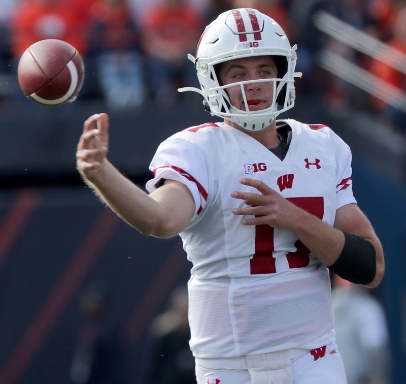 Oct 19, 2019; Champaign, IL, USA; Wisconsin Badgers quarterback Jack Coan (17) throws the ball the second quarter against the Illinois Fighting Illini at Memorial Stadium. Mandatory Credit: Mark Hoffman/Milwaukee Journal Sentinel via USA TODAY Sports