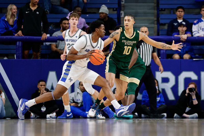 Mar 9, 2024; Colorado Springs, Colorado, USA; Air Force Falcons guard Byron Brown (11) controls the ball as Colorado State Rams guard Nique Clifford (10) guards in the first half at Clune Arena. Mandatory Credit: Isaiah J. Downing-USA TODAY Sports