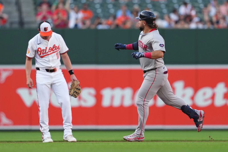 May 28, 2024; Baltimore, Maryland, USA; Boston Red Sox outfielder Wilyer Abreu (52) rounds the bases on a solo home run in the first inning past Baltimore Orioles third baseman Jordan Westburg (11) at Oriole Park at Camden Yards. Mandatory Credit: Mitch Stringer-USA TODAY Sports