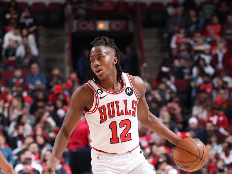 CHICAGO, IL - FEBRUARY 26: Ayo Dosunmu #12 of the Chicago Bulls dribbles the ball during the game against the Washington Wizards on February 26, 2023 at United Center in Chicago, Illinois. NOTE TO USER: User expressly acknowledges and agrees that, by downloading and or using this photograph, User is consenting to the terms and conditions of the Getty Images License Agreement. Mandatory Copyright Notice: Copyright 2023 NBAE (Photo by Jeff Haynes/NBAE via Getty Images)