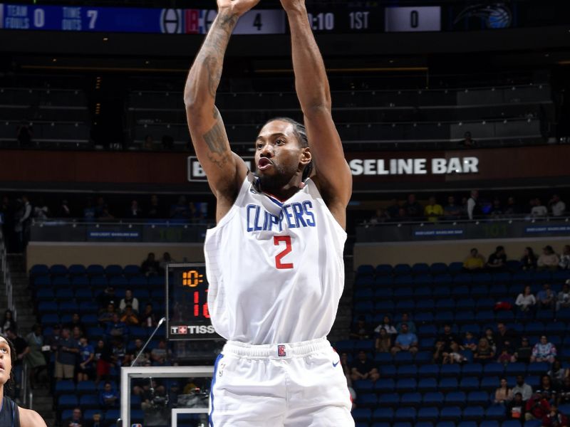 ORLANDO, FL - DECEMBER 7: Kawhi Leonard #2 of the LA Clippers shoots a three point basket during the game against the Orlando Magic on December 7, 2022 at Amway Center in Orlando, Florida. NOTE TO USER: User expressly acknowledges and agrees that, by downloading and or using this photograph, User is consenting to the terms and conditions of the Getty Images License Agreement. Mandatory Copyright Notice: Copyright 2022 NBAE (Photo by Fernando Medina/NBAE via Getty Images)