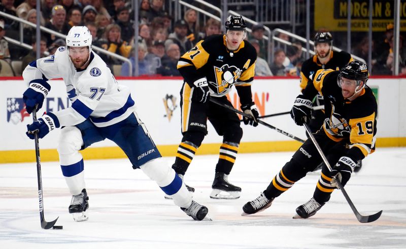 Apr 6, 2024; Pittsburgh, Pennsylvania, USA;  Tampa Bay Lightning defenseman Victor Hedman (77) moves the puck against the Pittsburgh Penguins during the third period at PPG Paints Arena. The Penguins won 5-4. Mandatory Credit: Charles LeClaire-USA TODAY Sports