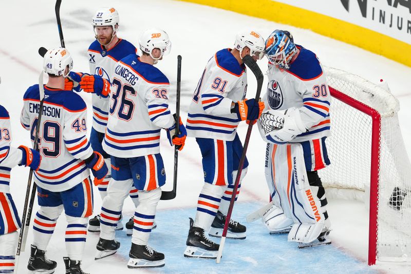 May 6, 2025; Las Vegas, Nevada, USA; Edmonton Oilers players celebrate after defeating the Vegas Golden Knights 4-2 in game one of the second round of the 2025 Stanley Cup Playoffs at T-Mobile Arena. Mandatory Credit: Stephen R. Sylvanie-Imagn Images