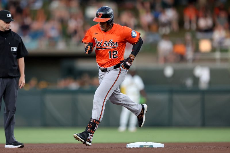 Jun 7, 2025; West Sacramento, California, USA; Baltimore Orioles right fielder Ramon Laureano (12) rounds the bases after hitting a two-run home run against the Athletics during the fourth inning at Sutter Health Park. Mandatory Credit: Dennis Lee-Imagn Images