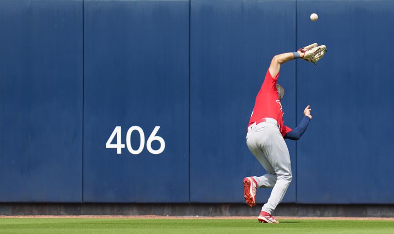 Mar 14, 2023; West Palm Beach, Florida, USA;  St. Louis Cardinals center fielder Dylan Carlson (3) makes a catch in the sixth inning against the Houston Astros at The Ballpark of the Palm Beaches. Mandatory Credit: Jim Rassol-USA TODAY Sports