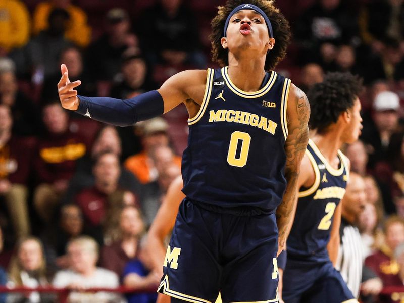 Dec 8, 2022; Minneapolis, Minnesota, USA; Michigan Wolverines guard Dug McDaniel (0) reacts to his shot against the Minnesota Golden Gophers during the first half at Williams Arena. Mandatory Credit: Matt Krohn-USA TODAY Sports