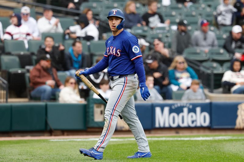 May 24, 2025; Chicago, Illinois, USA; Texas Rangers left fielder Wyatt Langford (36) reacts after striking out against the Chicago White Sox during the ninth inning at Rate Field. Mandatory Credit: Kamil Krzaczynski-Imagn Images