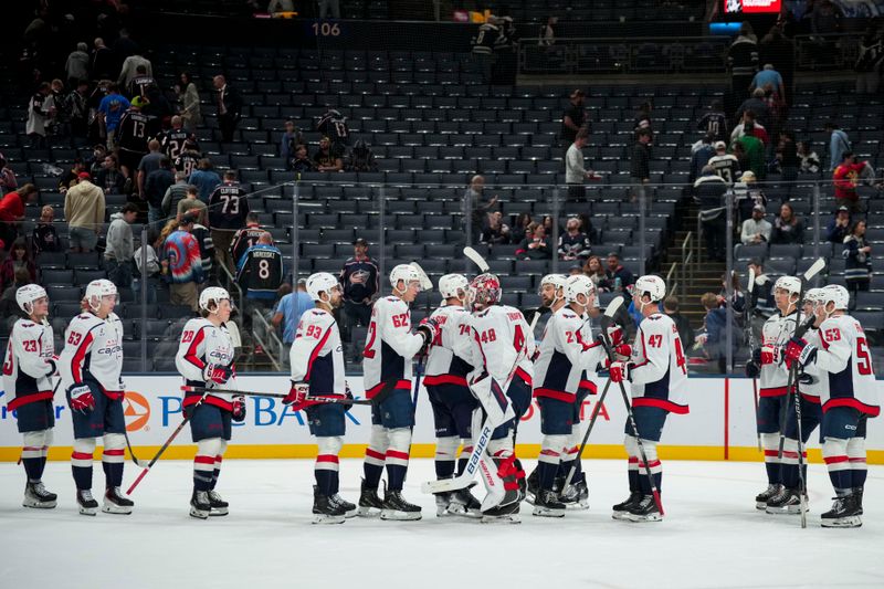 Sep 30, 2025; Columbus, Ohio, USA; The Washington Capitals celebrate after their game against the Columbus Blue Jackets at Nationwide Arena. Mandatory Credit: Aaron Doster-Imagn Images