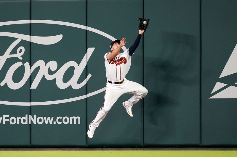 Apr 11, 2022; Atlanta, Georgia, USA; Atlanta Braves right fielder Adam Duvall (14) catches a fly ball against the Washington Nationals in the ninth inning at Truist Park. Mandatory Credit: Brett Davis-USA TODAY Sports