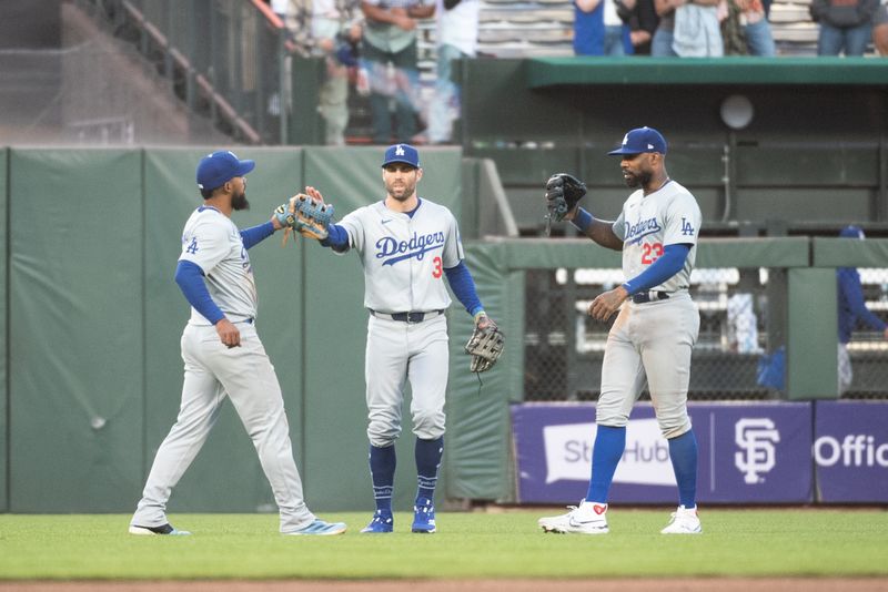 Jun 29, 2024; San Francisco, California, USA; Los Angeles Dodgers catcher Will Smith (16) and outfielder Chris Taylor (3) and outfielder Jason Heyward (23) celebrate after defeating the San Francisco Giants at Oracle Park. Mandatory Credit: Ed Szczepanski-USA TODAY Sports