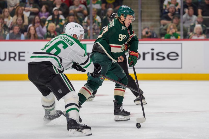 Sep 25, 2025; Saint Paul, Minnesota, USA; Minnesota Wild left wing Kirill Kaprizov (97) passes to a trailing left wing Matt Boldy (12) past Dallas Stars defenseman Ilya Lyubushkin (46) in the second period at Grand Casino Arena. Mandatory Credit: Matt Blewett-Imagn Images