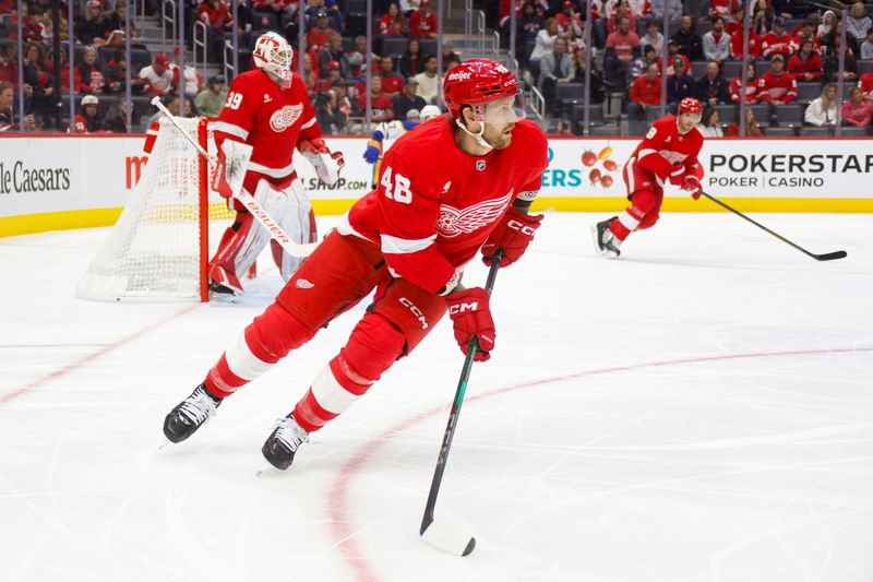 Nov 2, 2024; Detroit, Michigan, USA; Detroit Red Wings defenseman Jeff Petry (46) handles the puck during the first period of the game against the Buffalo Sabres at Little Caesars Arena. Mandatory Credit: Brian Bradshaw Sevald-Imagn Images