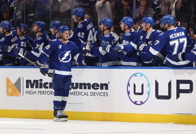 Oct 23, 2025; Tampa, Florida, USA; Tampa Bay Lightning center Jake Guentzel (59) is congratulated after he scored a goal against the Chicago Blackhawks during the second period at Benchmark International Arena. Mandatory Credit: Kim Klement Neitzel-Imagn Images