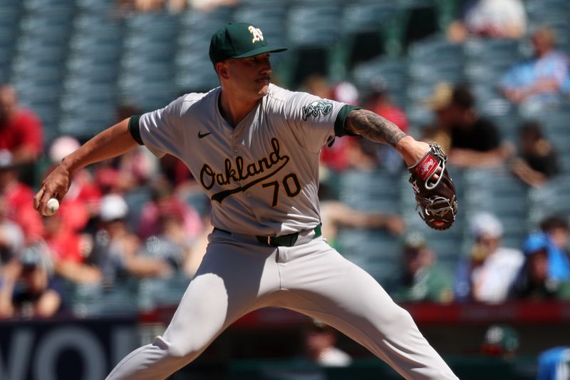 Jun 26, 2024; Anaheim, California, USA;  Oakland Athletics relief pitcher Lucas Erceg (70) pitches during the seventh inning against the Los Angeles Angels at Angel Stadium. Mandatory Credit: Kiyoshi Mio-USA TODAY Sports