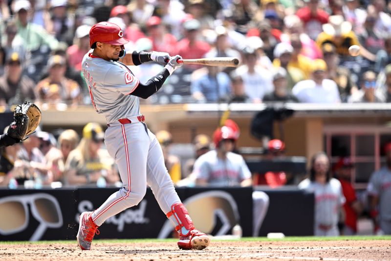 May 1, 2024; San Diego, California, USA; Cincinnati Reds third baseman Santiago Espinal (4) hits a double against the San Diego Padres during the fifth inning at Petco Park. Mandatory Credit: Orlando Ramirez-USA TODAY Sports