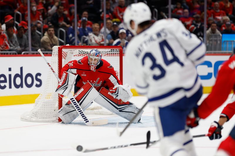 Oct 24, 2023; Washington, District of Columbia, USA; Washington Capitals goaltender Darcy Kuemper (35) prepares to make a save on Toronto Maple Leafs center Auston Matthews (34) in the second period at Capital One Arena. Mandatory Credit: Geoff Burke-USA TODAY Sports