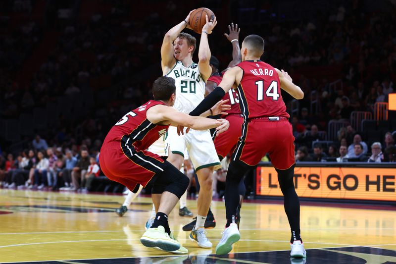 MIAMI, FLORIDA - NOVEMBER 26: AJ Green #20 of the Milwaukee Bucks drives to the basket against Tyler Herro #14 of the Miami Heat in the first quarter of the game during the Emirates NBA Cup at Kaseya Center on November 26, 2024 in Miami, Florida. NOTE TO USER: User expressly acknowledges and agrees that, by downloading and or using this photograph, User is consenting to the terms and conditions of the Getty Images License Agreement. (Photo by Megan Briggs/Getty Images)