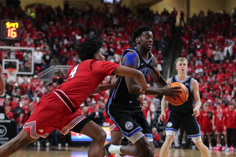 Jan 17, 2026; Lubbock, Texas, USA;  BYU Cougars forward AJ Dybantsa (3) is fouled by Texas Tech Red Raiders guard Christian Anderson (4) in the second half at United Supermarkets Arena. Mandatory Credit: Michael C. Johnson-Imagn Images