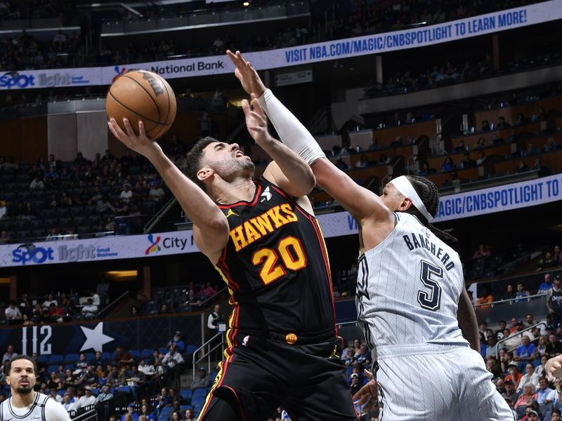 ORLANDO, FL - FEBRUARY 10: Georges Niang #20 of the Atlanta Hawks shoots the ball during the game against the Orlando Magic on February 10, 2025 at Kia Center in Orlando, Florida. NOTE TO USER: User expressly acknowledges and agrees that, by downloading and or using this photograph, User is consenting to the terms and conditions of the Getty Images License Agreement. Mandatory Copyright Notice: Copyright 2025 NBAE (Photo by Gary Bassing/NBAE via Getty Images)