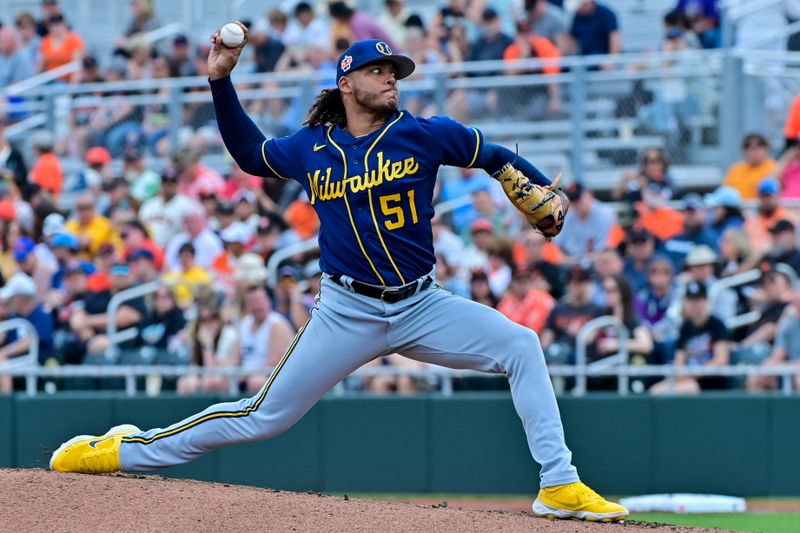 Mar 9, 2023; Scottsdale, Arizona, USA;  Milwaukee Brewers starting pitcher Freddy Peralta (51) throws in the first inning against the San Francisco Giants during a Spring Training game at Scottsdale Stadium. Mandatory Credit: Matt Kartozian-USA TODAY Sports