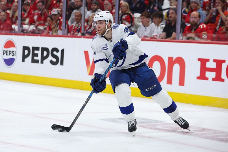 Apr 26, 2025; Sunrise, Florida, USA; Tampa Bay Lightning center Brayden Point (21) controls the puck against the Florida Panthers in the second period during game three of the first round of the 2025 Stanley Cup Playoffs at Amerant Bank Arena. Mandatory Credit: Nathan Ray Seebeck-Imagn Images