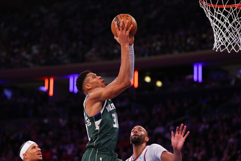 NEW YORK, NEW YORK - DECEMBER 25:  Giannis Antetokounmpo #34 of the Milwaukee Bucks drives to the basket during the third quarter against the New York Knicks at Madison Square Garden on December 25, 2023 in New York City.  NOTE TO USER: User expressly acknowledges and agrees that, by downloading and or using this photograph, User is consenting to the terms and conditions of the Getty Images License Agreement. (Photo by Rich Graessle/Getty Images)