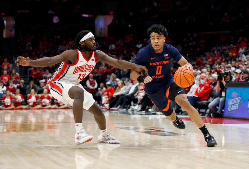 Feb 26, 2023; Columbus, Ohio, USA; Illinois Fighting Illini guard Terrence Shannon Jr. (0) drives in for the score as Ohio State Buckeyes guard Isaac Likekele (13) defends during the first half at Value City Arena. Mandatory Credit: Joseph Maiorana-USA TODAY Sports