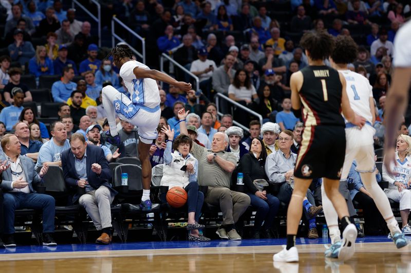 Mar 14, 2024; Washington, D.C., USA; North Carolina forward Jae'Lyn Withers (24) leaps into the stands attempting to save the ball against Florida State in the second half at Capital One Arena. Mandatory Credit: Geoff Burke-USA TODAY Sports