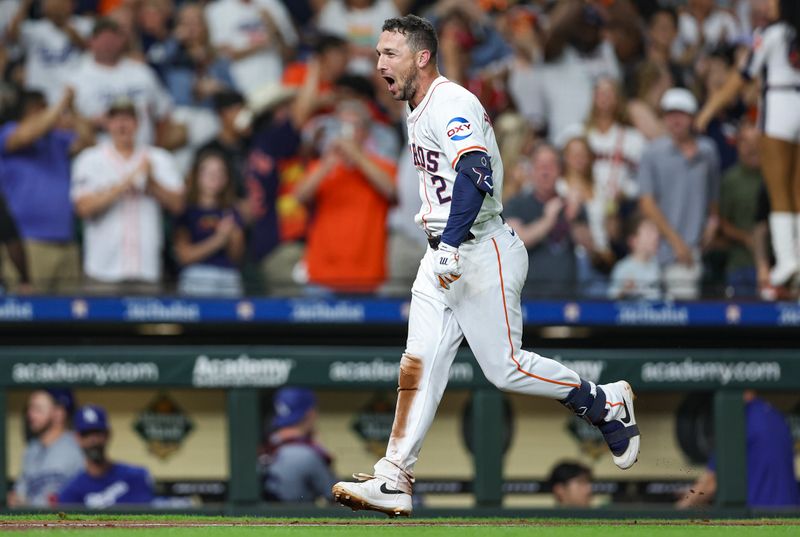Jul 27, 2024; Houston, Texas, USA; Houston Astros third baseman Alex Bregman (2) runs towards home plate after hitting a walk-off home run during the ninth inning against the Los Angeles Dodgers at Minute Maid Park. Mandatory Credit: Troy Taormina-USA TODAY Sports