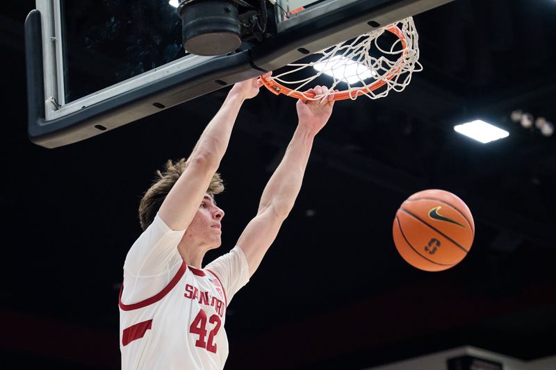 Jan 18, 2024; Stanford, California, USA; Stanford Cardinal forward Maxime Raynaud (42) dunks the ball against the Washington State Cougars during the second half at Maples Pavilion. Mandatory Credit: Robert Edwards-USA TODAY Sports