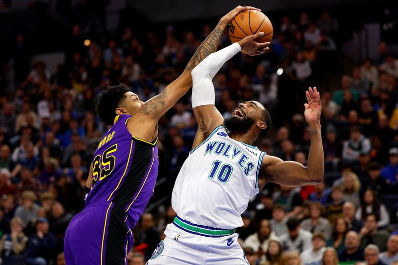 MINNEAPOLIS, MINNESOTA - DECEMBER 30: Christian Wood #35 of the Los Angeles Lakers blocks a shot by Mike Conley #10 of the Minnesota Timberwolves in the second quarter at Target Center on December 30, 2023 in Minneapolis, Minnesota. NOTE TO USER: User expressly acknowledges and agrees that, by downloading and or using this photograph, User is consenting to the terms and conditions of the Getty Images License Agreement. (Photo by David Berding/Getty Images)