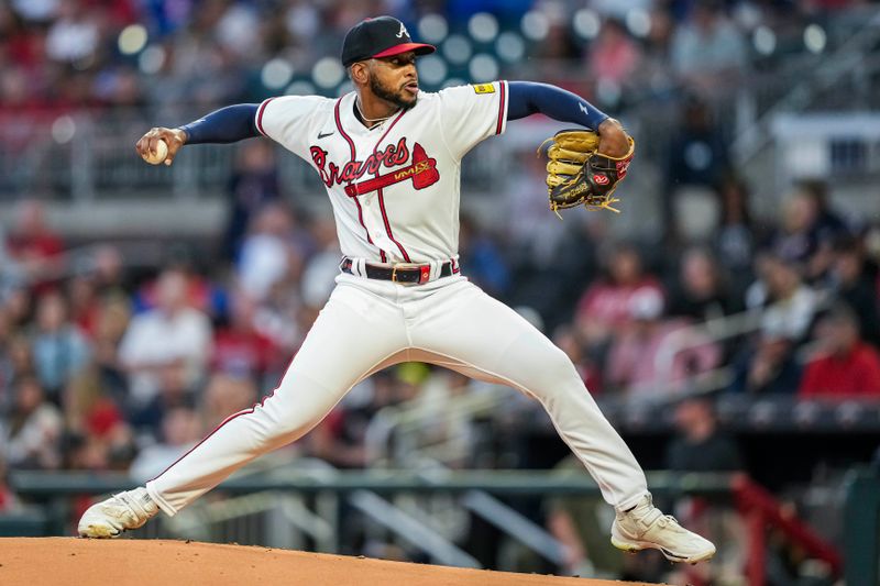 Sep 27, 2023; Cumberland, Georgia, USA; Atlanta Braves starting pitcher Darius Vines (64) pitches against the Chicago Cubs during the first inning at Truist Park. Mandatory Credit: Dale Zanine-USA TODAY Sports