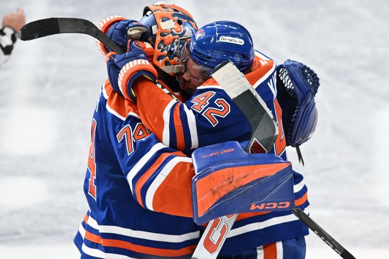 Jun 4, 2025; Edmonton, Alberta, CAN; Edmonton Oilers goaltender Stuart Skinner (74) reacts with right wing Kasperi Kapanen (42) after defeating the Florida Panthers in overtime for game one of the 2025 Stanley Cup Final at Rogers Place. Mandatory Credit: Walter Tychnowicz-Imagn Images