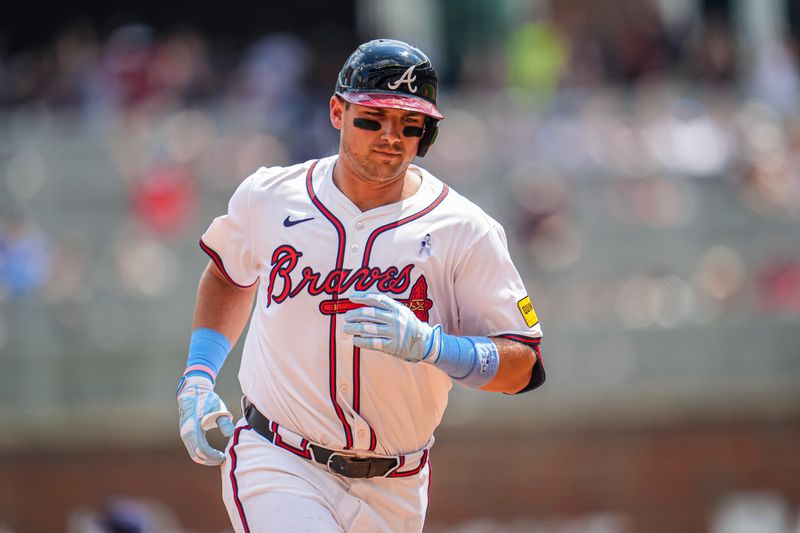 Jun 16, 2024; Cumberland, Georgia, USA; Atlanta Braves third baseman Austin Riley (27) reacts after hitting a game tying two run home run against the Tampa Bay Rays during the eighth inning at Truist Park. Mandatory Credit: Dale Zanine-USA TODAY Sports