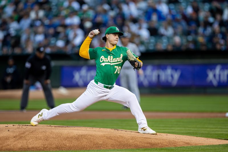 Sep 20, 2024; Oakland, California, USA; Oakland Athletics pitcher J.T. Ginn (70) throws a pitch during the first inning against the New York Yankees at Oakland-Alameda County Coliseum. Mandatory Credit: Bob Kupbens-Imagn Images