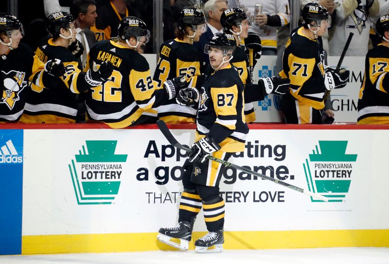 Dec 3, 2022; Pittsburgh, Pennsylvania, USA;  Pittsburgh Penguins center Sidney Crosby (87) celebrates his goal with the Pens bench against the St. Louis Blues during the third period at PPG Paints Arena. The Penguins won 6-2. Mandatory Credit: Charles LeClaire-USA TODAY Sports